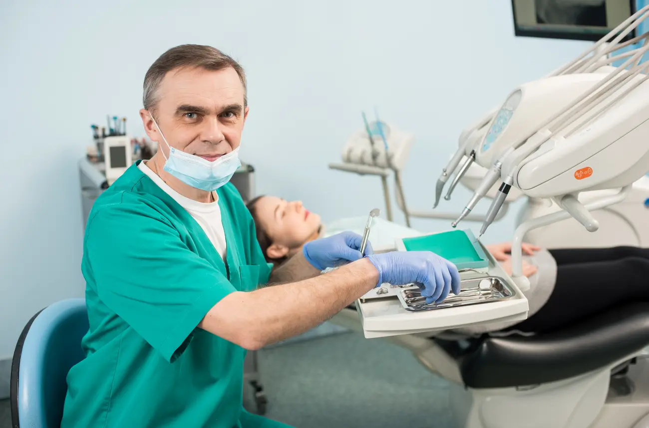 portrait of senior male dentist with dental equipm 2023 11 27 05 17 09 utc